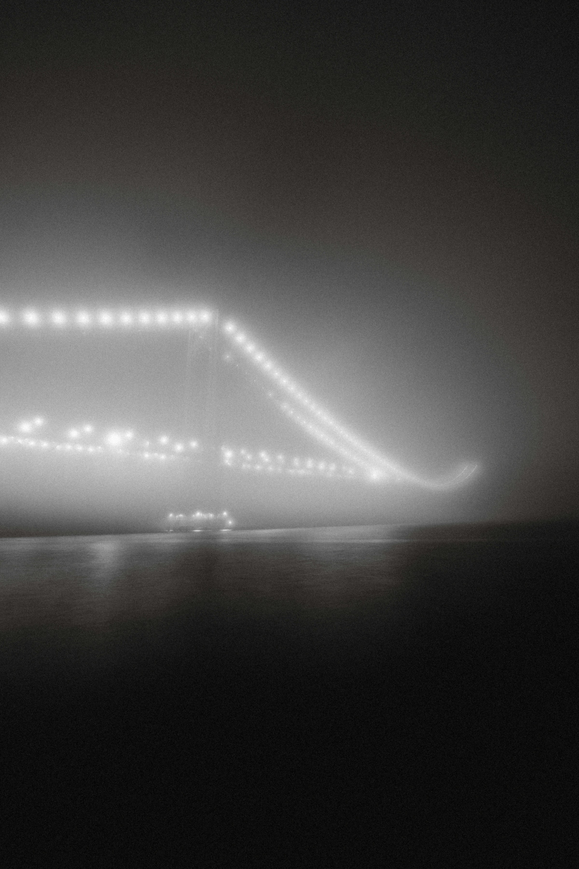 Long-exposure bridge in fog