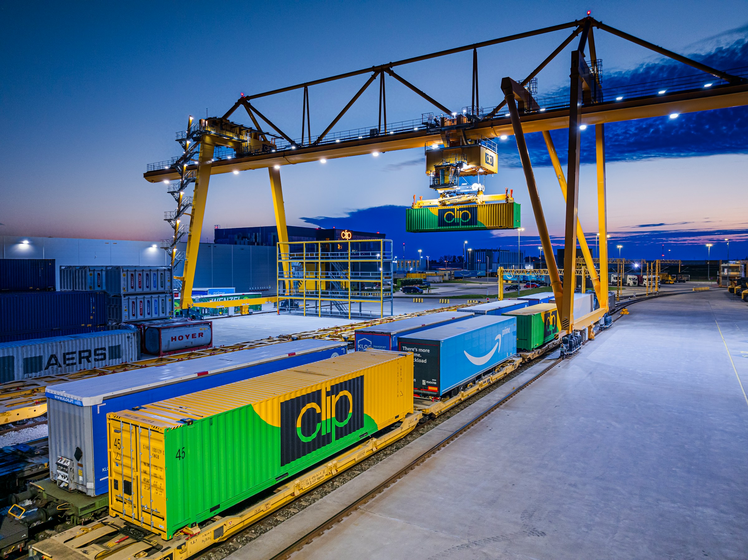 Gantry crane loading at dusk